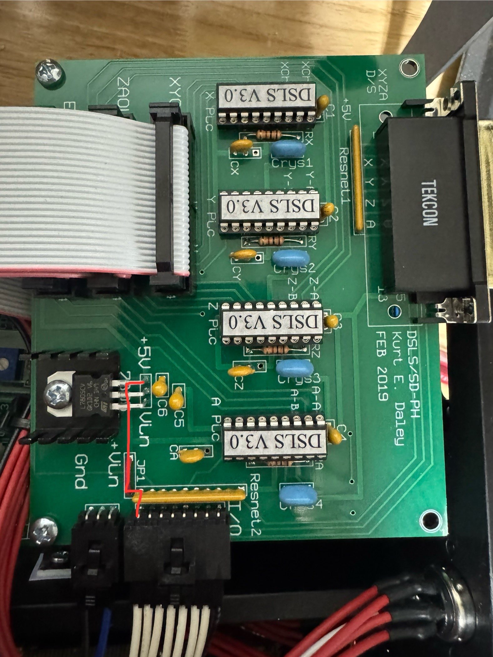 Top of the DSLS board on the 2024-era Taig mill controller box, with the trace connecting the EMO pin to 5V highlighted with a red line