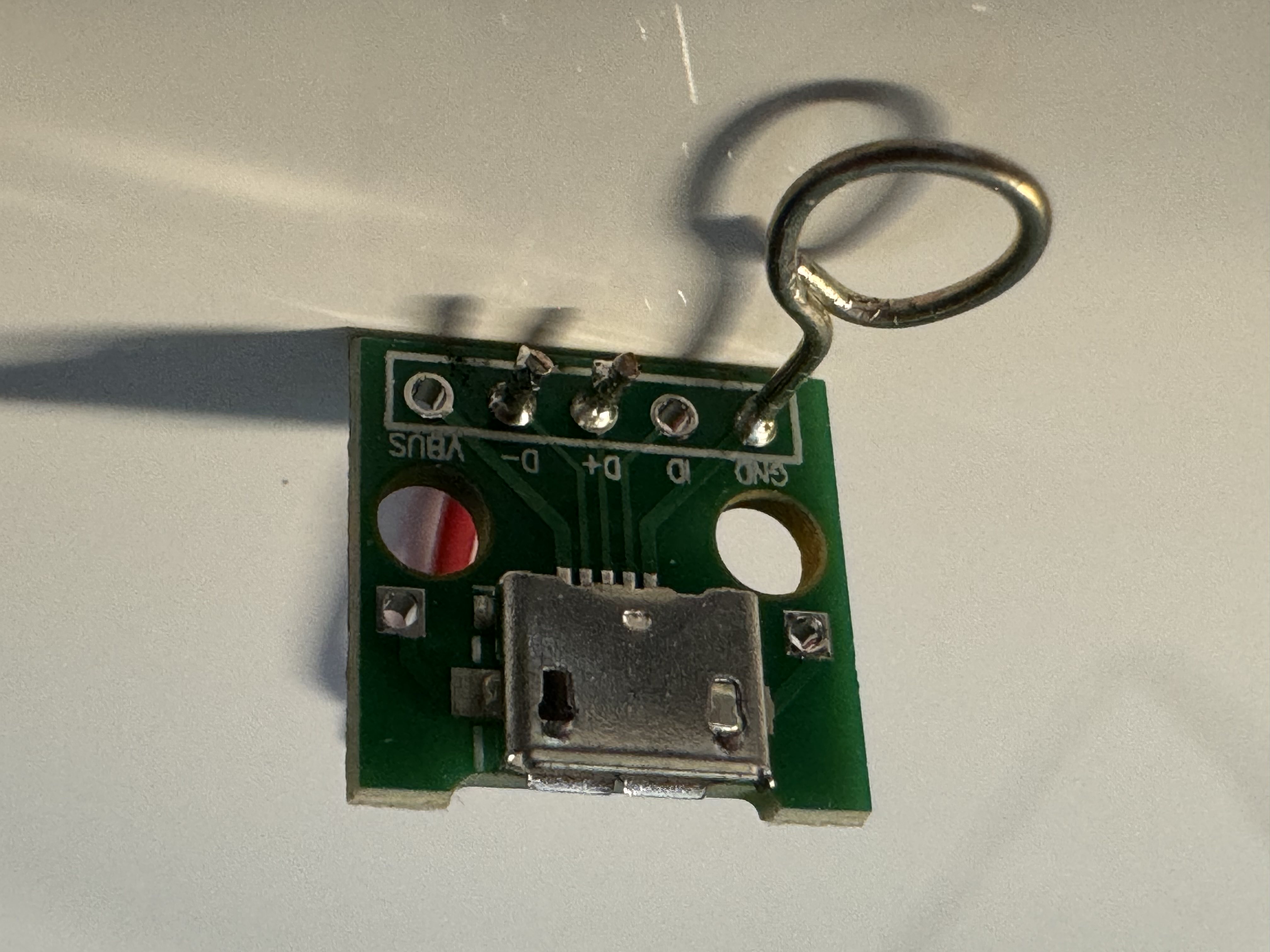 Quick and dirty adapter for the Dreame robot debug port, using a standard USB micro-A breakout board