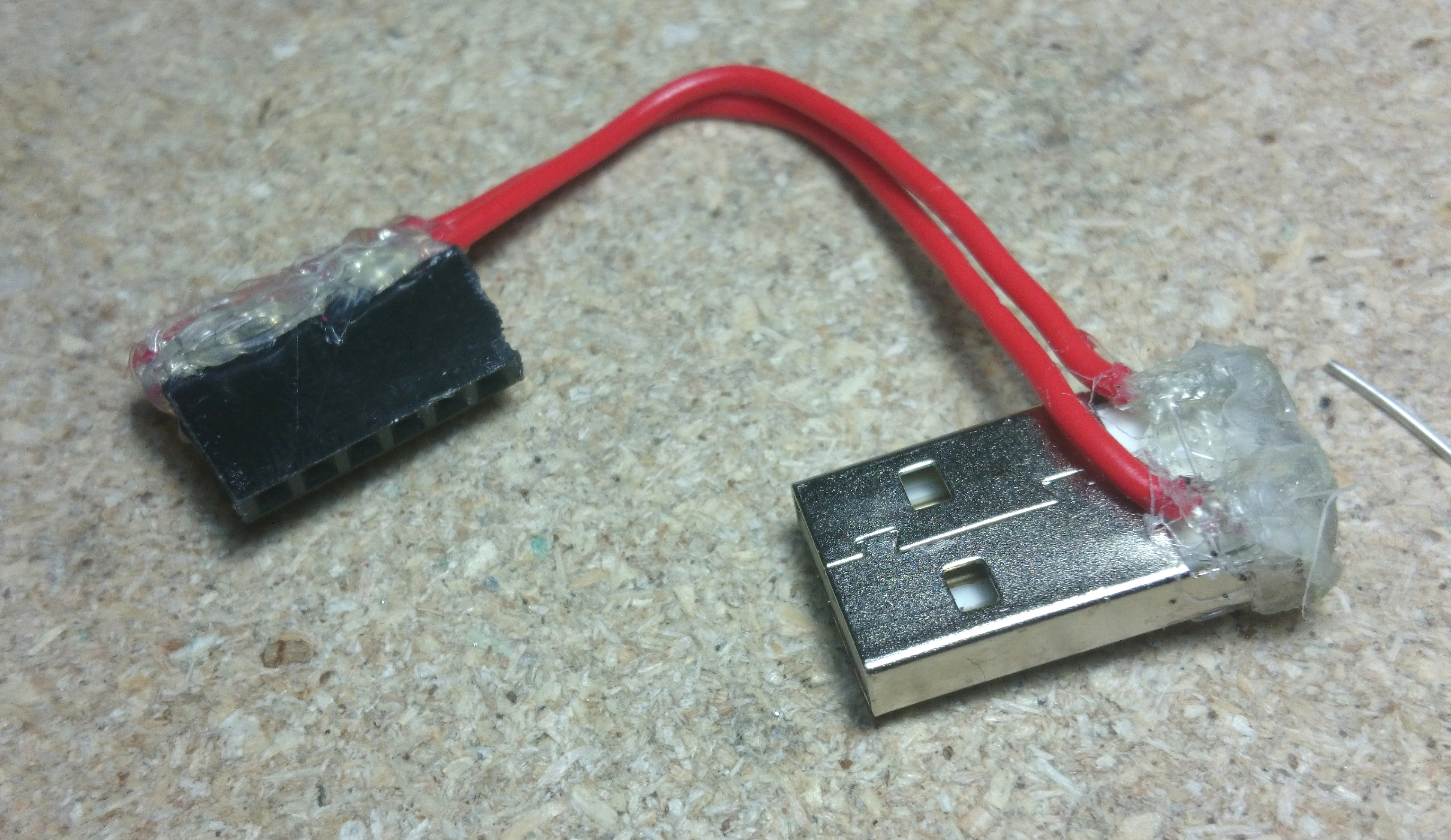 USB-A plug, with the 5V and GND pins connected to a 6-pin female header