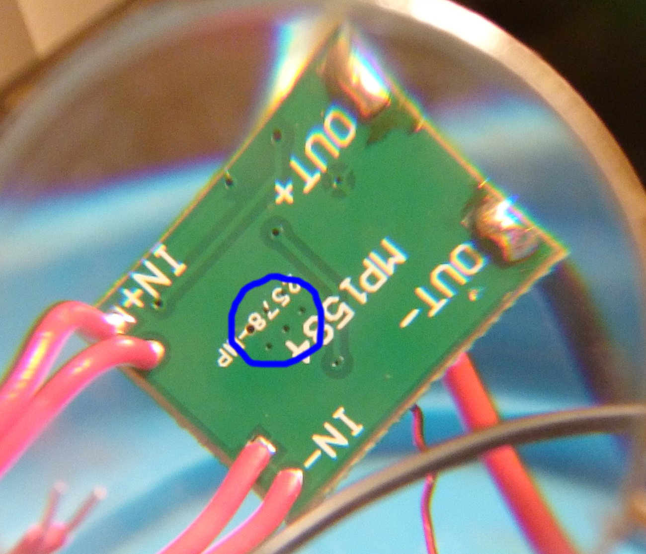Close-up of the thermal vias, which are circled in blue, on the DC regulator board